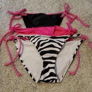 Set of 3 string bikini bottoms. Size small.
